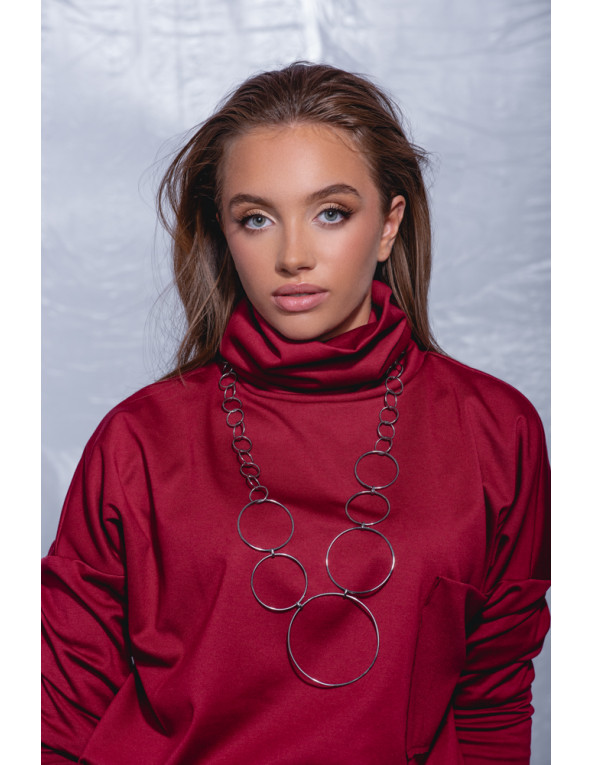 Długi naszyjnik Koło ze stali szlachetnej w kolorze srebrnym z elementami o różnej średnicy.