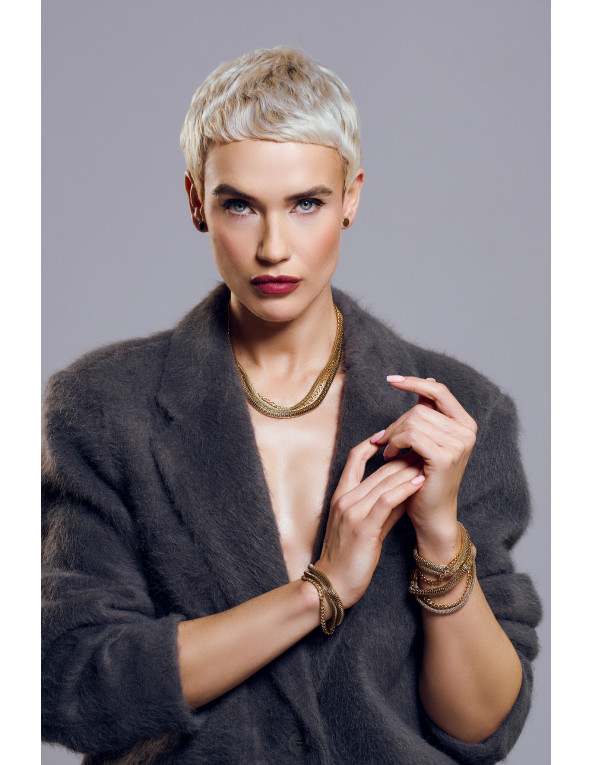 Złota bransoleta ze stali szlachetnej z trzech połączonych łańcuszków.