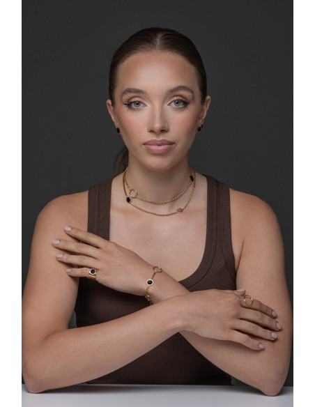 Złoty sygnet damski z matowej stali szlachetnej z błyszczącym czarnym oczkiem