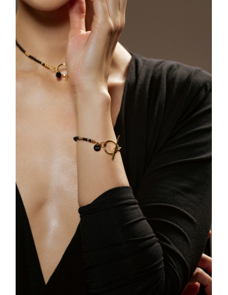 Delikatna bransoletka z onyksów i złotych kuleczek